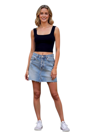 Hippy Haven model wearing a black Ruby Street scoop neck cropped tank top with a denim mini skirt and white sneakers.